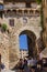 San Gimignano, Italy - 08.26.2017: Ancient millstones in a narrow alley in San Gimignano, Tuscany