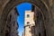 San Gimignano, Italy - 08.26.2017: Ancient millstones in a narrow alley in San Gimignano, Tuscany