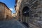 San Gimignano, Italy - 12/09/2013: Warm colors of Street of medieval San Gimignano Tuscany