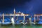 San Giorgio Maggiore church and gondolas in Venice, Italy during blue hour with dramatic sky and lighting. Focus on the church.