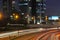 San Isidro aerial view of skyscraper and corporations at night with highway with traffic