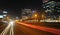 San Isidro aerial view of skyscraper and corporations at night with highway with traffic