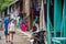 San Jose Succotz, Cayo, Belize - June 18, 2022: Tourists browse wares and Mayan crafts adjacent to the hand-cranked ferry