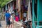 San Jose Succotz, Cayo, Belize - June 18, 2022: Tourists browse wares and Mayan crafts adjacent to the hand-cranked ferry