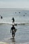 San Juan del Sur, Nicaragua, January 19, 2018: Playa Maderas, touristic surf spot in Nicaragua. Panoramic view with surfers around