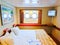 San Juan, Puerto Rico - May 08, 2016: inside cabin with two portholes at The Carnival Cruise Ship Fascination