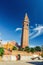 San Martino Roman Catholic church in Burano island with brick bell tower campanile