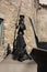 San Panza statue and Don Quixote built in black steel by an unknown author against a medieval brick wall