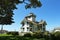 SAN PEDRO, CALIFORNIA - 27 AUG 2021: Point Fermin Lighthouse, framed by trees, is on the National Register of Historic Places