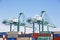 San Pedro/California - April 4, 2020: Los Angeles Harbor Shipyard cranes at work unloading cargo ship containers.