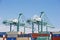 San Pedro/California - April 4, 2020: Los Angeles Harbor Shipyard cranes at work unloading cargo ship containers.
