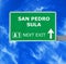 SAN PEDRO SULA road sign against clear blue sky