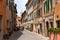 San Quirico d`Orcia, Italy - April 24, 2018: Street view of San Quirico d`Orcia. A small typical town in Italy