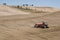 SAN QUIRICO D`ORCIA, TUSCANY / ITALY - OCTOBER 31, 2016: Undefined man on a tractor in the beautiful tuscan landscape