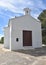 San Salvador Hermitage, a small white chapel overlooking the resort town of Calpe, Alicante, Spain