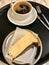 San Sebastian Cheesecake Slice with Americano Coffee served with Tray at Cafe Shop.