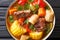 Sancocho Recipe a hearty and absolutely delicious stew made with meat, vegetables and spice close-up on a plate. horizontal top