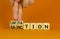 Sanction and limitation symbol. Businessman turns cubes, changes the word limitation to sanction. Beautiful orange table, orange