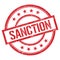 SANCTION text written on red vintage stamp