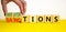 Sanctions or negotiations symbol. Businessman turns cubes, changes the word sanctions to negotiations. Beautiful yellow table,