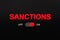 Sanctions switch on the black panel. Activated ON-OFF switch and luminous word SANCTIONS. Modern digital concept of