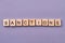 Sanctions word made of wooden cubes.