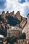 Sanctuary Lady of Montserrat and the mountain. Abbey architecture against a cloudy sky. Emptyncopy space