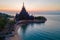 Sanctuary of Truth, Pattaya, Thailand, wooden temple by the ocean at sunset on the beach of Pattaya