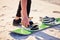 Sand, adventure and feet of man with board for desert surfing, extreme sports and action hobby in nature. Freedom