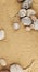 Sand background with sea smooth oval pebbles.