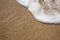 Sand background with wave. Beautiful sand background and wave fr