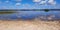 Sand beach and blue summer sky at Biscarrosse lake in landes France