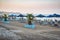 Sand beach decorated with palm trees in Faliraki town on Rhodes island, Greece