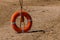 Sand, beach, lifebuoy on the beach. Inventory of rescuers on the beach