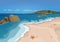 Sand beach and sea, vector colorful graphic drawing. Sandy shore with starfish and seashells, sea waves, ocean, rocks in the sea