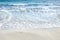 Sand beach, summer sea water with wave. Cala azzurra beach, Favignana island, Sicily, Italy. Wet sand on empty beach