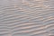 Sand Beach with sunset and Natural wave pattern in sand on a beach texture