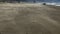 Sand Blowing Away From Camera On Beach