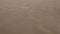 Sand is blown on a deserted beach