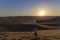 Sand boarding ,Dune Buggy parked in the desert during sunset at Huacachina Oasis in Ica, Peru