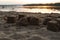 Sand cakes on the beach by the river at sunset, close-up.