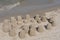 Sand castles and towers built on a beach at the sea in summer on a sunny day