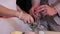 Sand ceremony being performed at wedding. Hands of