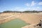 Sand deep quarry under a blue cloudy sky