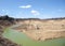 Sand deep quarry under a blue cloudy sky