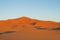 Sand desert dunes panorama at sunset