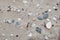 Sand and different stone pebbles on seaside