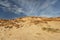 Sand dune with blue sky