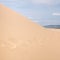 Sand dune with footsteps