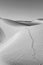 Sand dune in sunrise in the sonoran desert with human footsteps in the sand